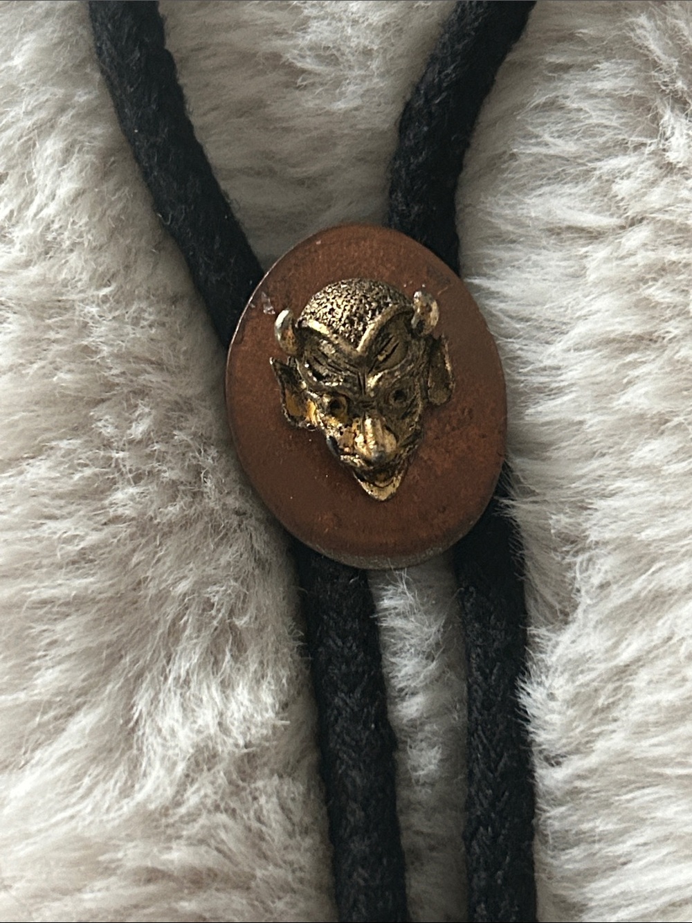 Custom made bolo tie with vintage devil head and smashed copper coin